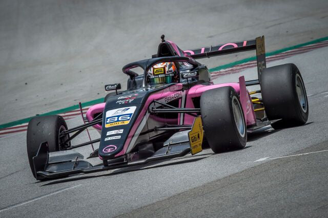 Closeup of the pink Oloi F3 car on the track