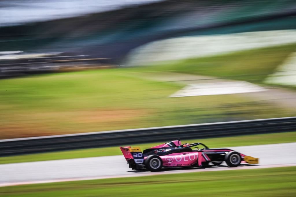 The pink Oloi F3 car on Sepang Circuit in Malaysia